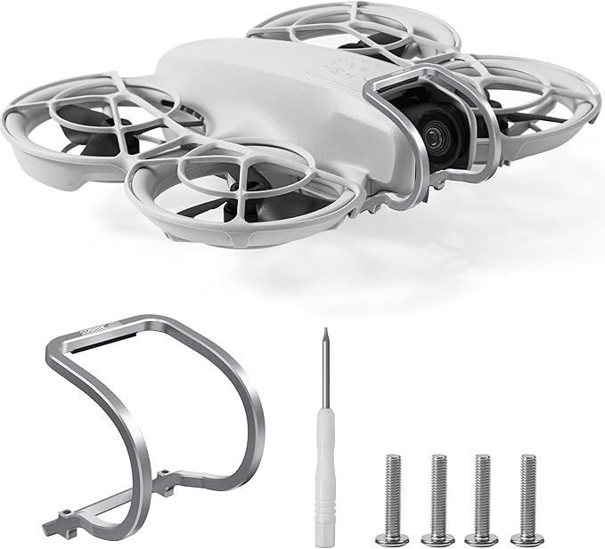 Small drone with protective frame, camera, and set of assembly tools including a screwdriver and screws.