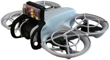 Close-up view of a small quadcopter drone with propeller guards and a mounted camera.