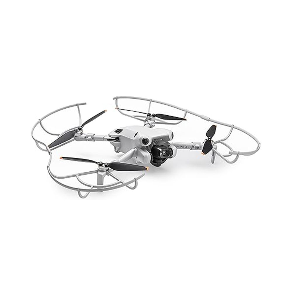 White quadcopter drone with propeller guards and a camera, viewed from the front angle.