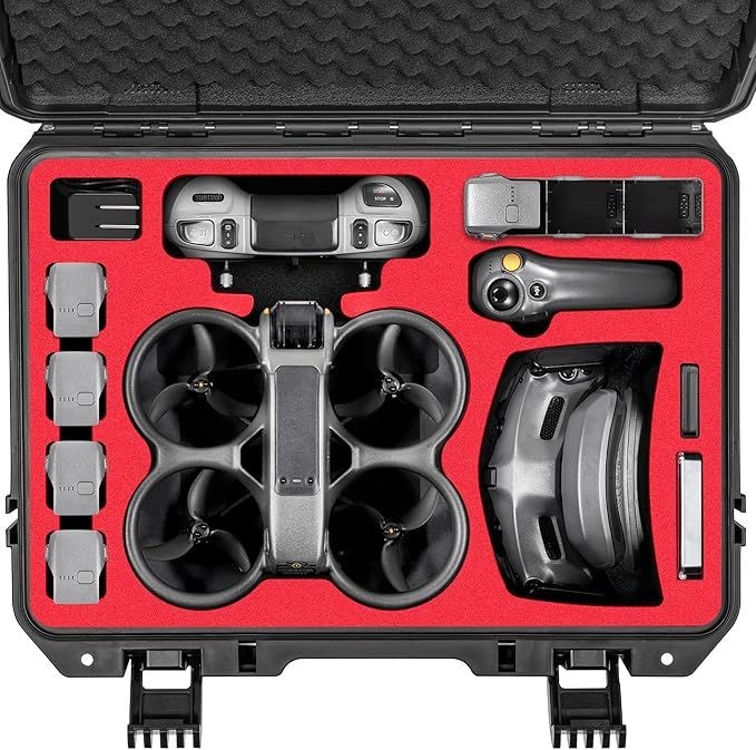 Open case with drone, controller, batteries, and accessories fitted inside red foam slots.