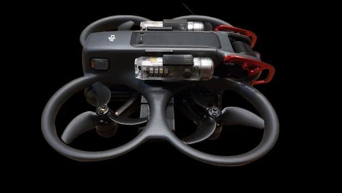 Close-up view of a drone with enclosed propellers and camera mounted on a black background.