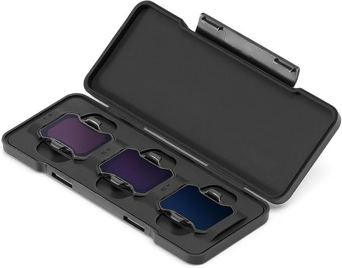 Open black case with four different color filters arranged inside, each in its own slot.