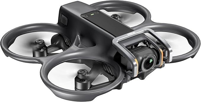 A black quadcopter drone with a camera, featuring protective propeller guards.